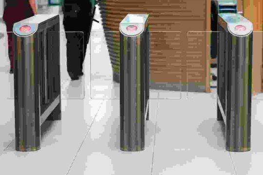 A person walking in front of a counter.