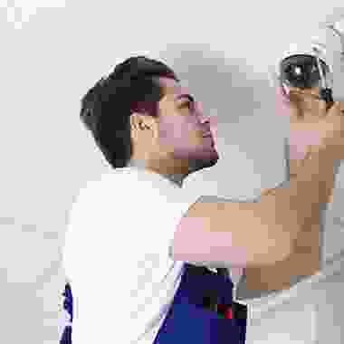 A man holding a camera in his hand.