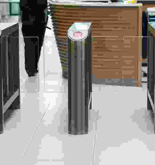 A person walking in front of a counter.