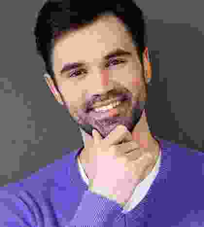 A man with his hand under his chin.