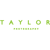 A black background with green letters that say taylor photography.