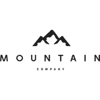 A black and white logo of the mountain company.