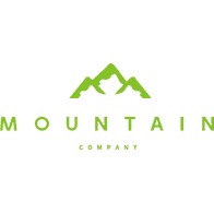 A black background with green letters that say mountain company.