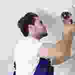 A man is standing in front of a mirror