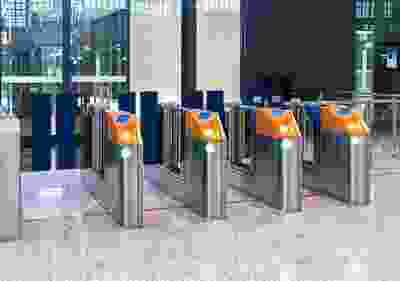 A row of metal gates with orange and blue accents.