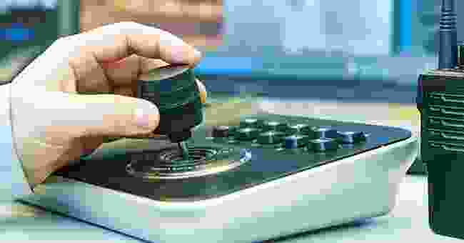 A person is using a button to press the buttons.