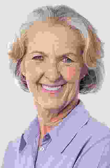 A woman with blonde hair and blue eyes.