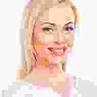 A woman with blonde hair and pink lipstick.