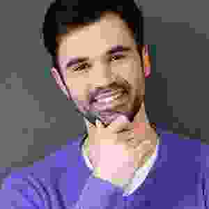 A man with his hand under his chin.