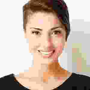 A woman with short hair is smiling for the camera.