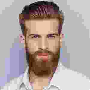 A man with a beard and mustache is wearing white shirt