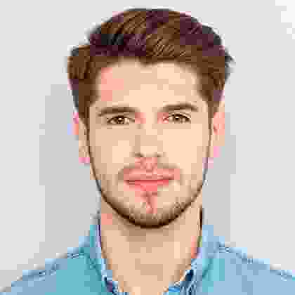 A man with brown hair and blue shirt.