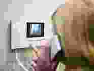 A person holding something in their hand.